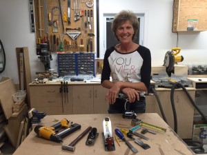Marilynn smiling with array of tools
